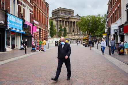 People wearing masks while shopping in the city centre in Preston