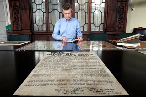 Shane Mawe, assistant librarian at Trinity College, with the historic proclamation document.