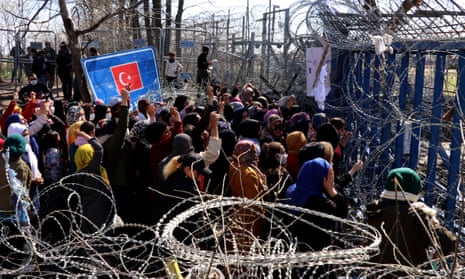 Asylum seekers in Turkey marching towards Kastanies border crossing in March during a rally calling for Greece to open the border gate.