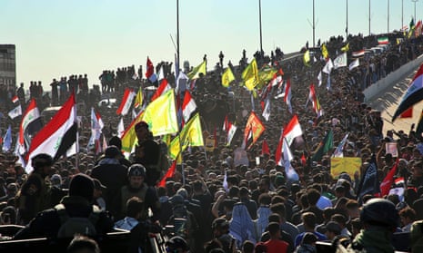 Mourners gather during a funeral procession for Abu Mahdi al-Muhandis, deputy commander of Iran-backed militias in Basra, Iraq, Tuesday, Jan. 7, 2020. Thousands of people gathered in Basra on Tuesday to bid farewell to Abu Mahdi al-Muhandis, a senior Iraqi militia commander who was killed in a US airstrike on Friday. (AP Photo)