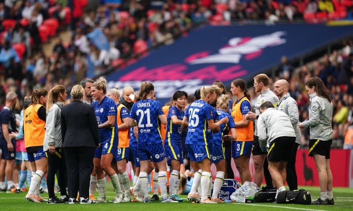 Chelsea players take on board refreshment and instructions from their coaching staff before the start of the second half of extra-time.
