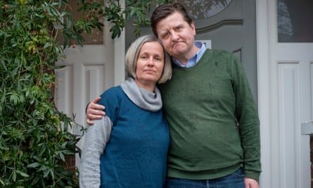 Alison and Graham Miller with their arms round each other outside
