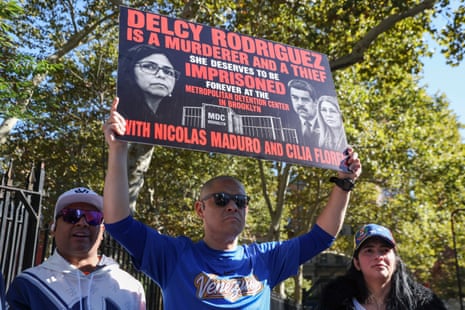 a man holds a sign outside