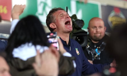 Wrexham's manager, Phil Parkinson, celebrates the win and promotion