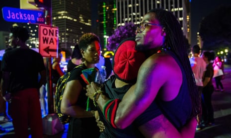 Protestors react after shots were fired during a protest on Thursday in Dallas.