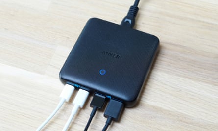 The Anker 543 charger with four USB cables plugged into it.