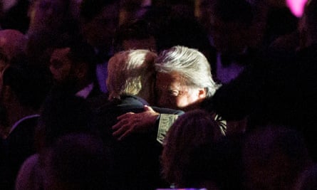 Donald Trump (L), hugs his former chief strategist Steve Bannon after speaking during the 111th New York Young Republicans Gala in New York, on Saturday.