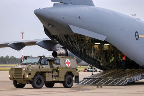 A Bushmaster PMV is loaded into a C-17 Globemaster which is headed for Ukraine.