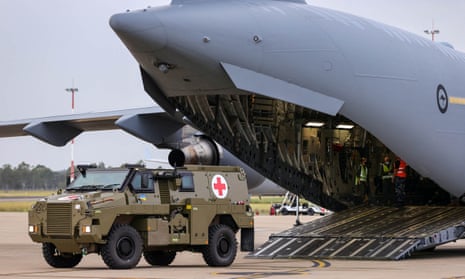 A Bushmaster vehicle is loaded in Brisbane before being sent to Ukraine
