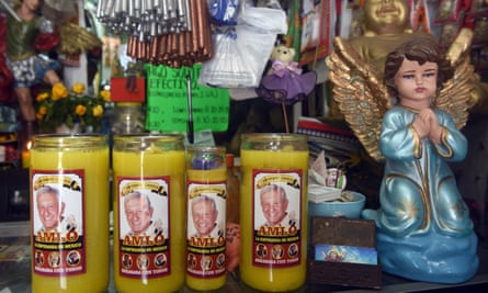 Candles with pictures of Amlo sold in a market in the Mexican city of Villahermosa, his hometown, on 22 June 2018.