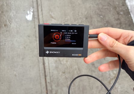 A person using a SnowSky/FiiO Echo MP3 player