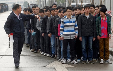 men looking for work with foxconn queueing up in shenzhen china