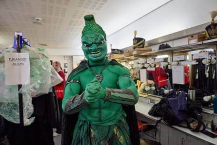 Actor and stuntman James Unsworth has his body painted green in preparation for his role as the executioner.
