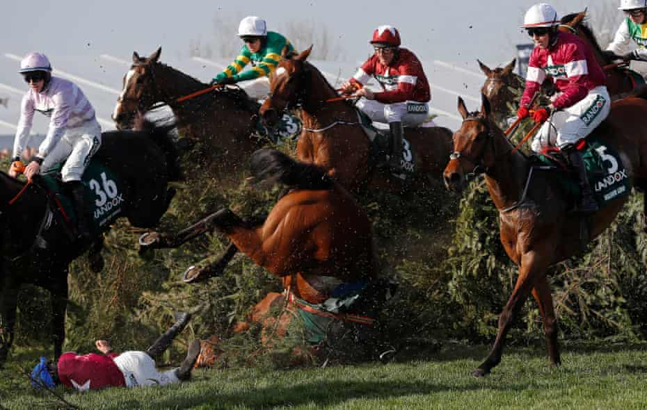 FIFAPRO Tom Jenkins’s best sports photos of 2018 10 Rachael Blackmore falls off Alpha des Obeaux at the Chair fence just in front of eventual winner Tiger Roll during the Grand National on day three of the Grand National meeting at Aintree Racecourse in April 2018