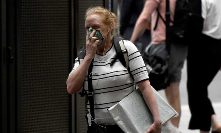 A woman wears a mask in Sydney