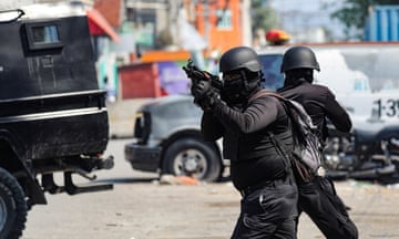 Police officers with weapons in Port-au-Prince, Haiti