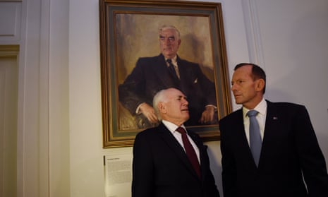 Tony Abbott (right) and John Howard stand next to a portrait of Robert Menzies.