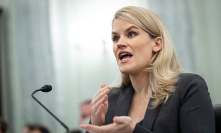 Frances Haugen, a woman with blond hair wearing a black blazer, speaks into a microphone during a Senate hearing.