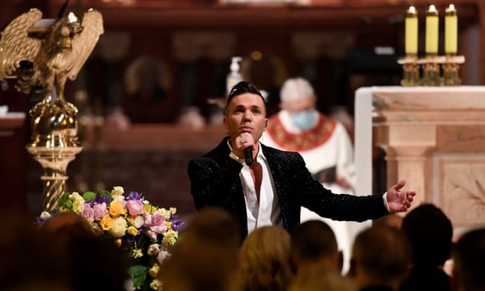 Anthony Callea sings to an audience wearing a black jacket and white shirt