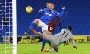 Brighton &amp; Hove Albion’s Aaron Connolly scores their first goal.