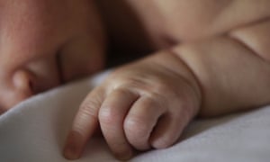 Newborn lying in bed