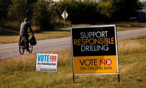 Road signs in Texas illustrate both sides of the fracking debate. The industry creates jobs but environmentalists and others have voiced concerns.