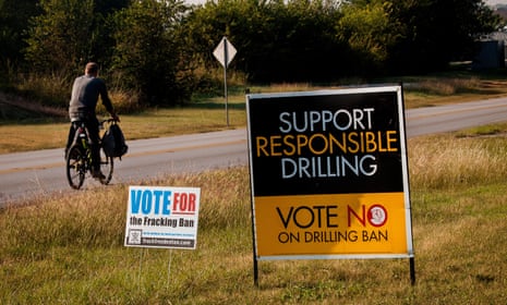 Road signs in Texas illustrate both sides of the fracking debate. The industry creates jobs but environmentalists and others have voiced concerns.