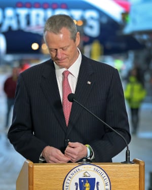 Massachusetts governor Charlie Baker speaks to the press on Thursday in front of a plane that delivered masks from China.