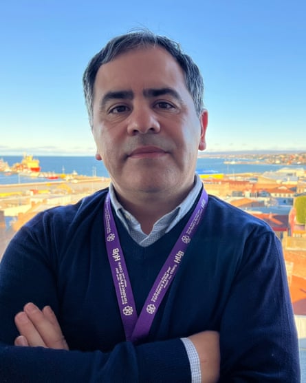 A man in front of an urban backdrop