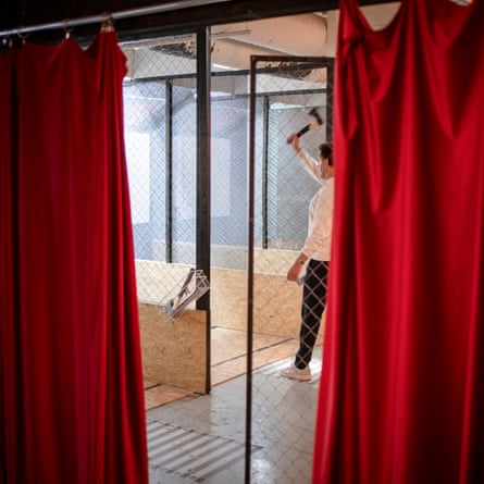 A Swedish man raising an ax to throw it in a bunker in Helsinki.