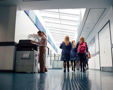 Girls walking in a school corridor