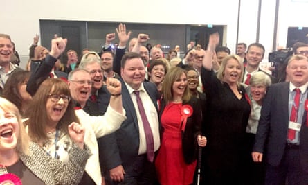 Labour councillors in Trafford celebrate after the Conservatives lost overall control.