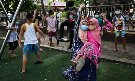 Children play at a public park, as Manila loosens coronavirus disease restrictions
