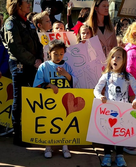 Children with signs saying we heart ESA