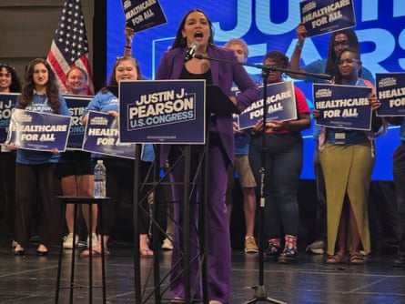 a woman stands at a podium