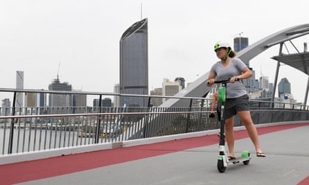 An e-scooter rider crosses the Goodwin Bridge in Brisbane.