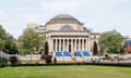 grand university building with a lawn in front