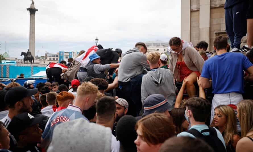 Fans in fan zone barriers at Trafalgar Square in London.
