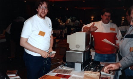 Gary Bowser, left, in his 20s demonstrating projects for the TI-99 home computer event at the Chicago TI fair in the early 90s.