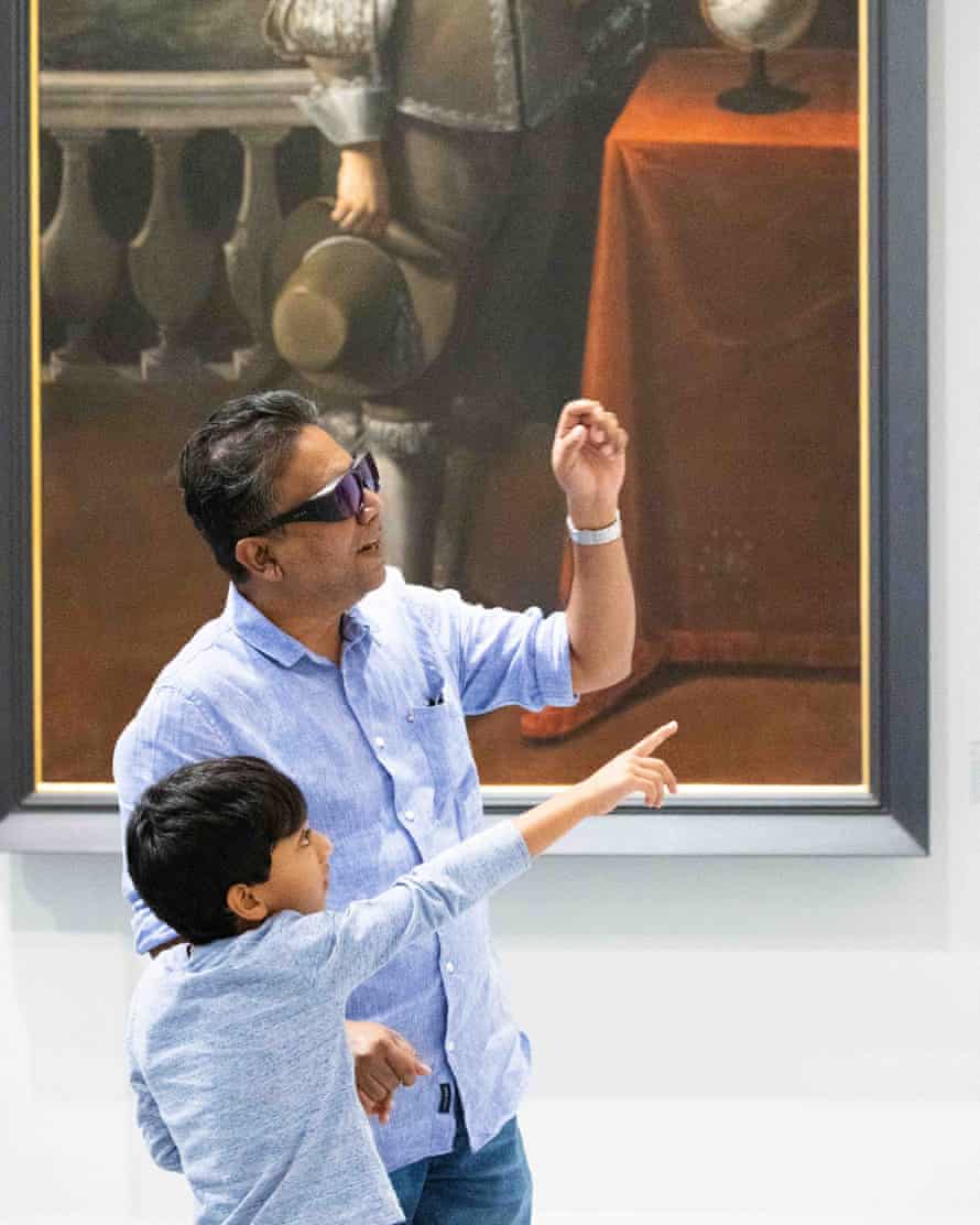 A visitor wearing EnChroma glasses at the Chau Chak Wing Museum.