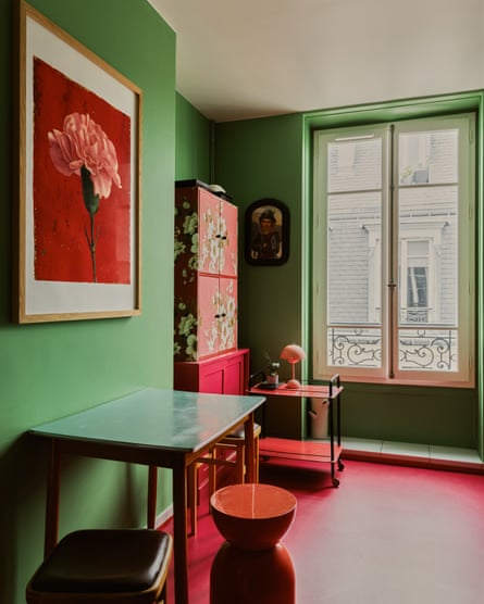 A vintage Japanese cabinet ties the reds and greens of the room together.