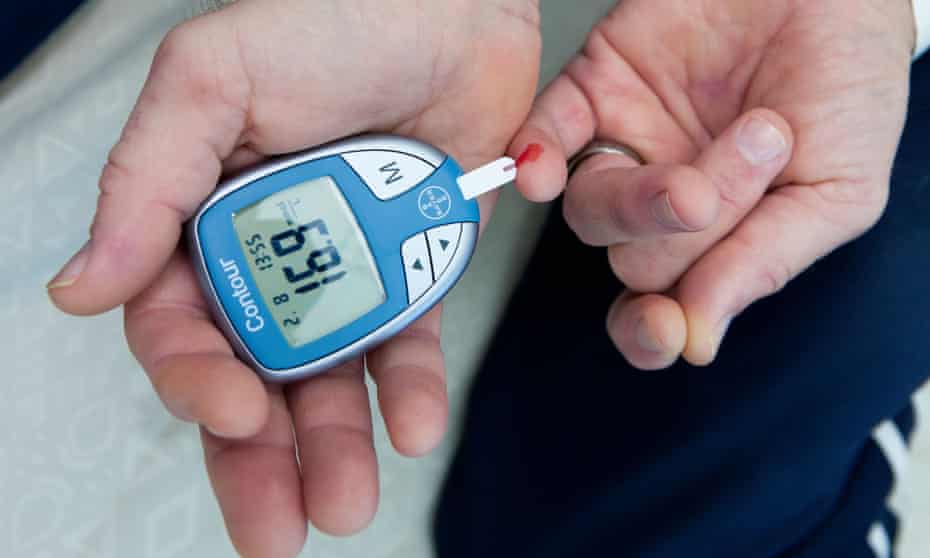 A man tests his blood sugar level