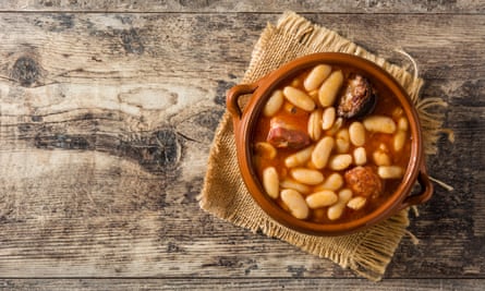 Typical Spanish Fabada AsturianTypical Spanish fabada asturiana on wooden table