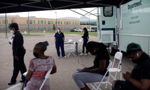 A mobile vaccination clinic hosted by the Detroit Health Department administers Covid-19 vaccinations.