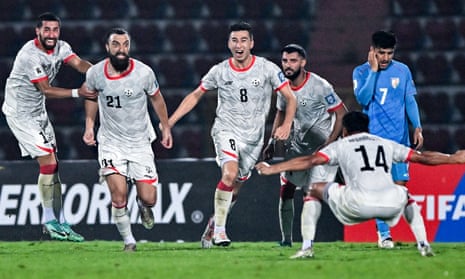 Afghanistan's Sharif Mukhammad (second from left) celebrates with teammates after scoring the late winner against India in Guwahati on Tuesday.