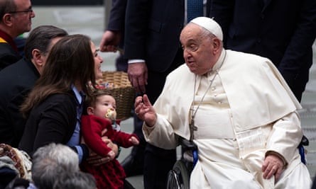 Francis greeting a woman and her baby during the Jubilee Audience.