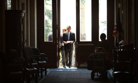 man walks through big doors