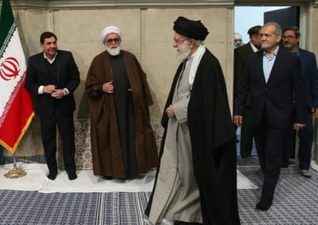Khamenei and President Masoud Pezeshkian, right, meeting Iranian government officials in Tehran, 2025.