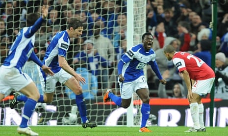 Obafemi Martins celebrates after scoring the winner for Birmingham City against Arsenal in the League Cup final in 2011.
