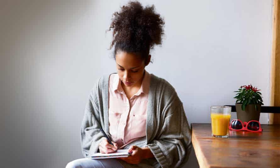 Woman writing in journal